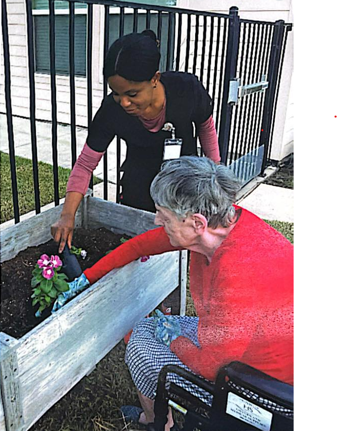 Resident enjoying gardening activities at Affectionate Care memory care Richmond TX